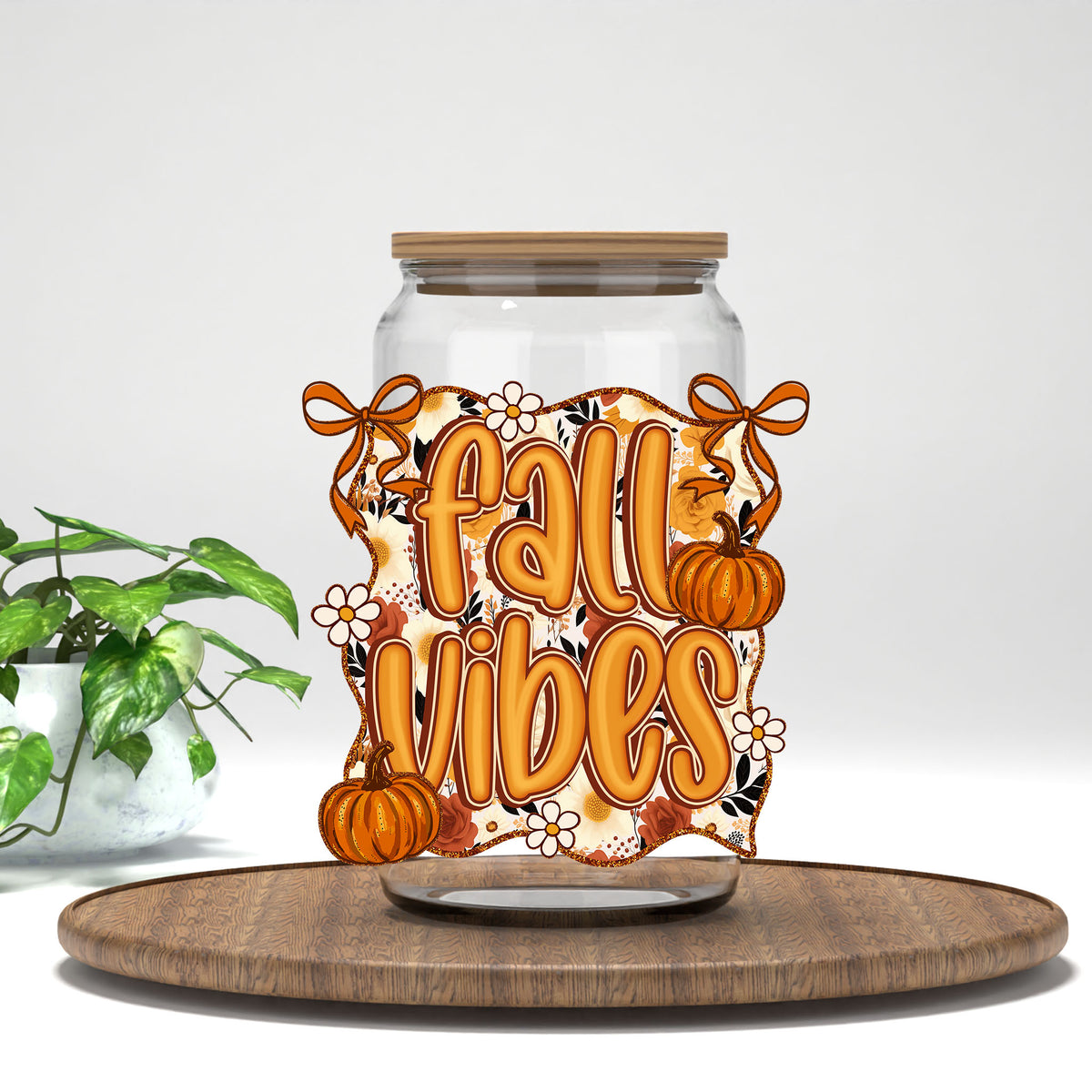 Fall Vibes pumpkins and bows UV DTF transfer on a clear glass can