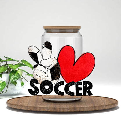 Peace Love Soccer UV DTF transfer on a clear glass can