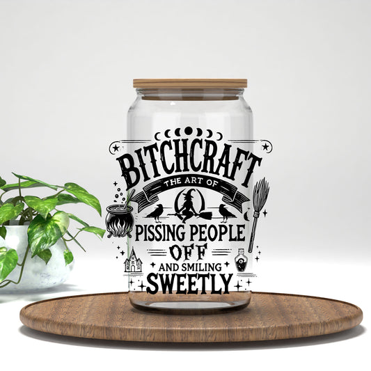B*tchcraft UV DTF transfer on a clear glass can