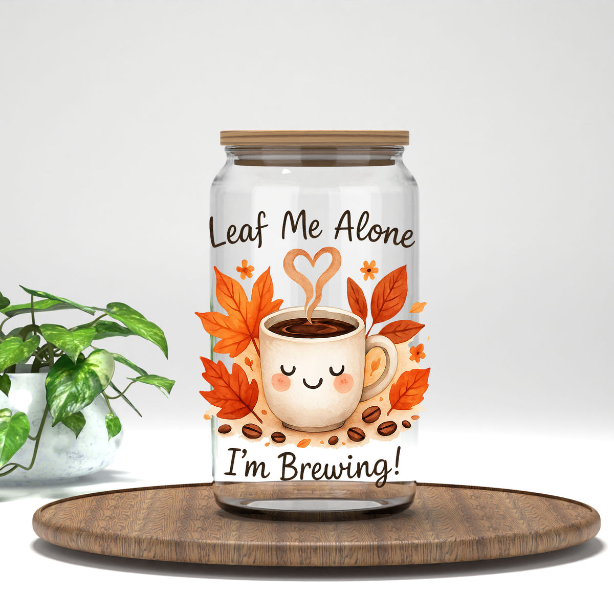 Leaf Me Alone I'm Brewing UV DTF transfer on a clear glass can