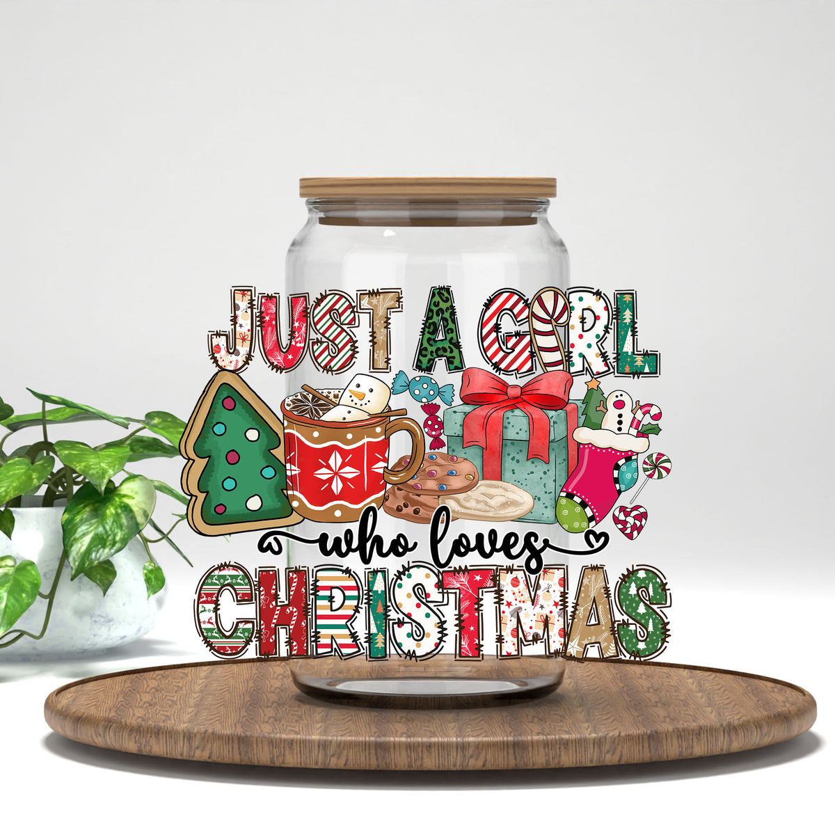 Just a Girl Who Loves Christmas UV DTF transfer on a clear glass can