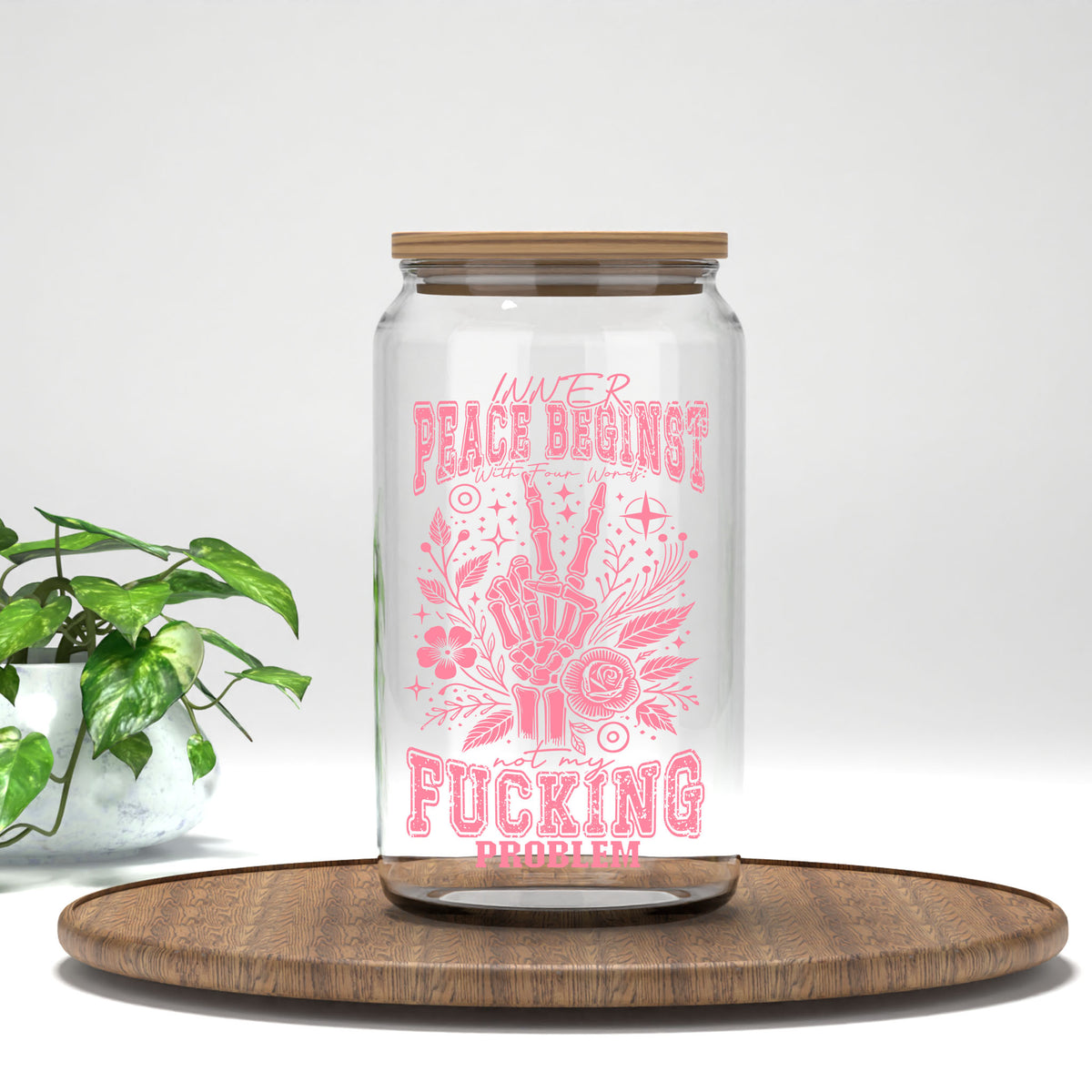 Inner Peace Begins With Four Words pink skeleton hand UV DTF transfer on a clear glass can