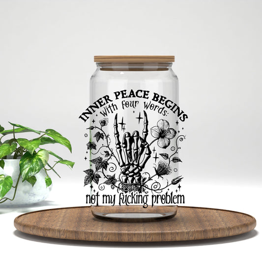 Inner Peace Begins With Four Words black skeleton hand UV DTF transfer on a clear glass can