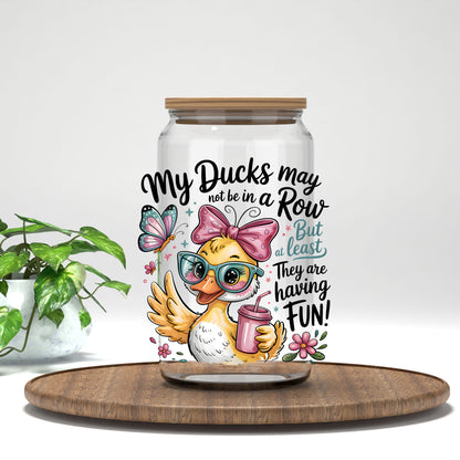 My Ducks May Not Be in a Row duck with a pink drink UV DTF transfer on a clear glass can