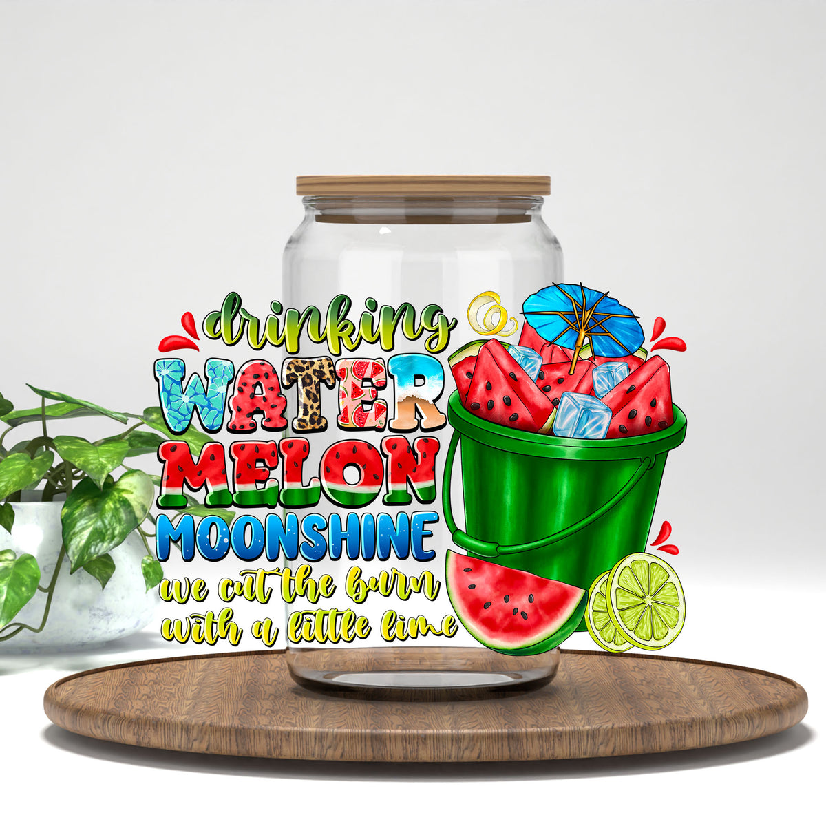 Drinking Watermelon Moonshine UV DTF transfer on a clear glass can