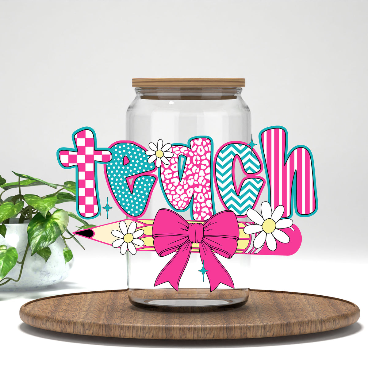 Teach pink bow and pencil UV DTF transfer on a clear glass can