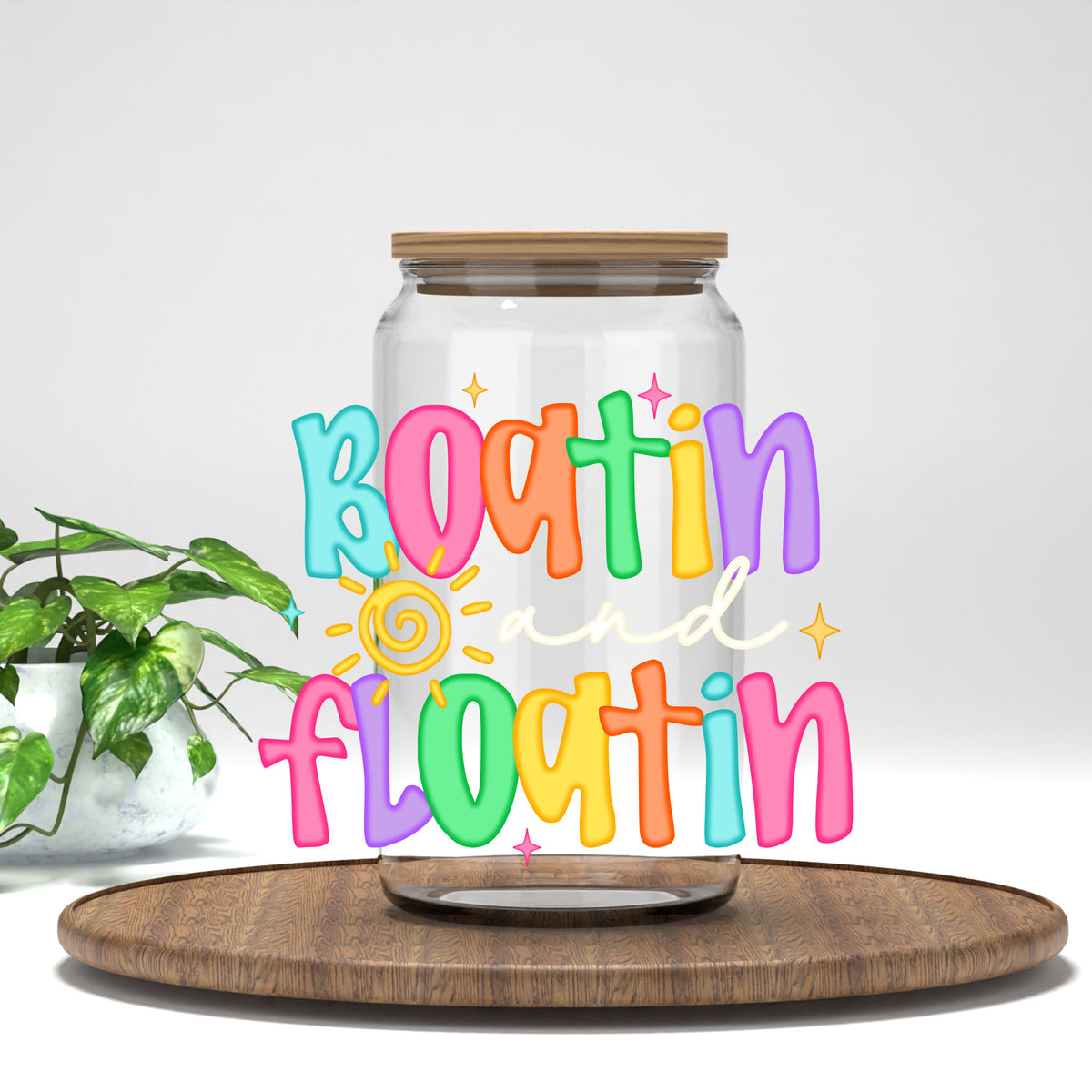 Boatin' and Floatin' UV DTF transfer on a clear glass can