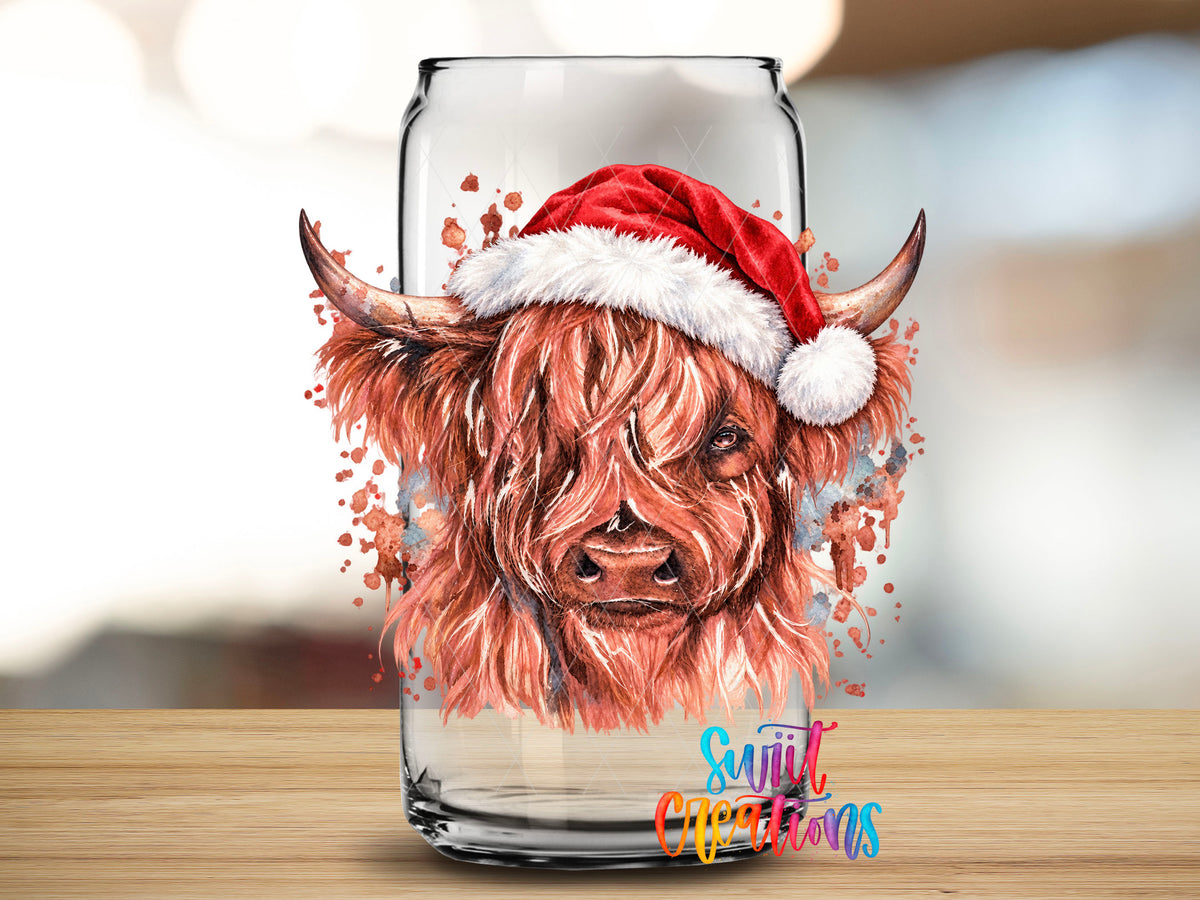 Close-up of the Cow With Santa Hat UV DTF transfer on a clear glass can