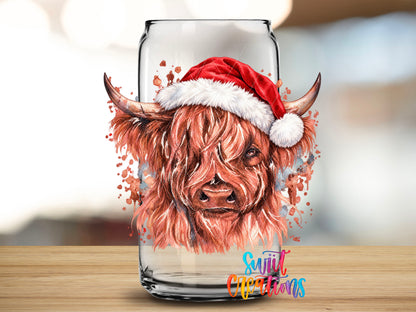 Close-up of the Cow With Santa Hat UV DTF transfer on a clear glass can
