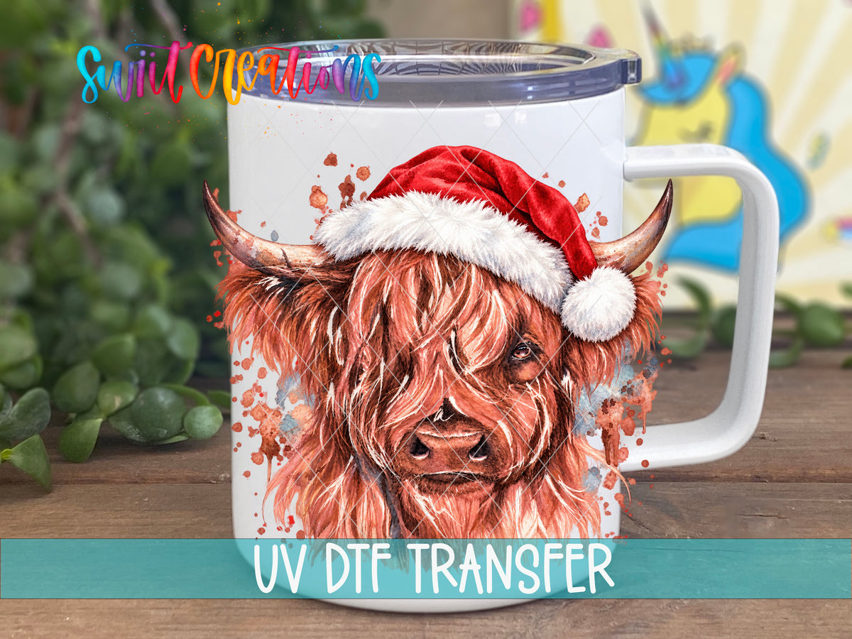 Cow With Santa Hat UV DTF transfer on a white stainless steel mug with a lid