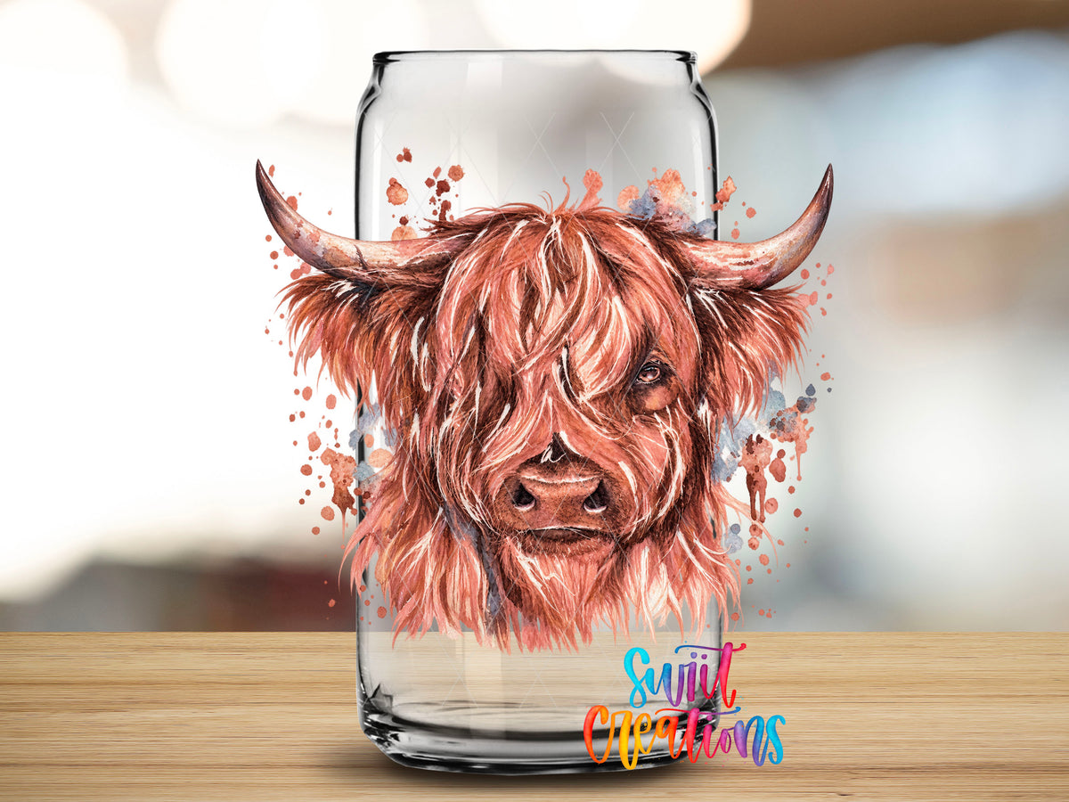 Close-up of the Highland Cow watercolor UV DTF transfer on a clear glass can