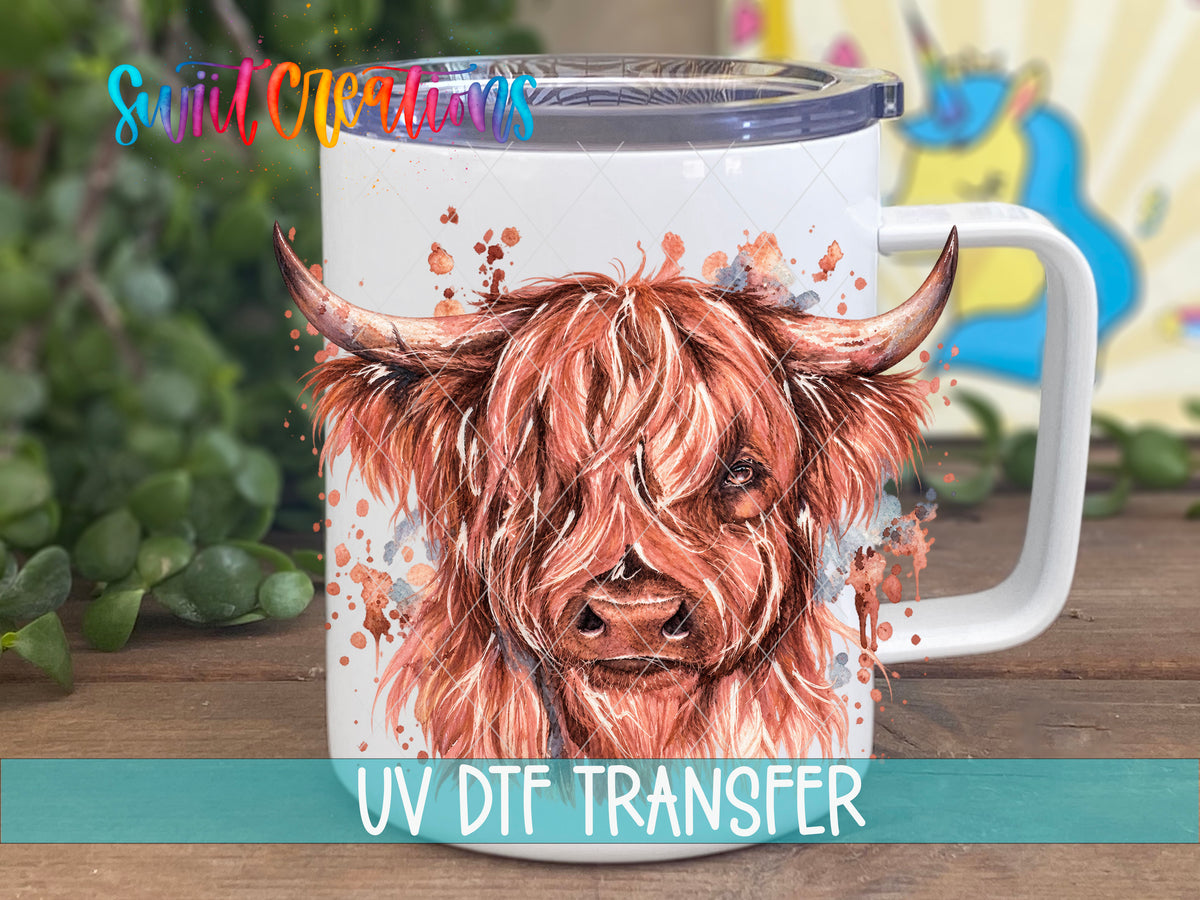 Highland Cow watercolor UV DTF transfer on a white stainless steel mug with a lid
