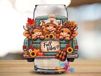 Close-up of the Fall Vibes Cute Cows highland cow UV DTF transfer on a clear glass can