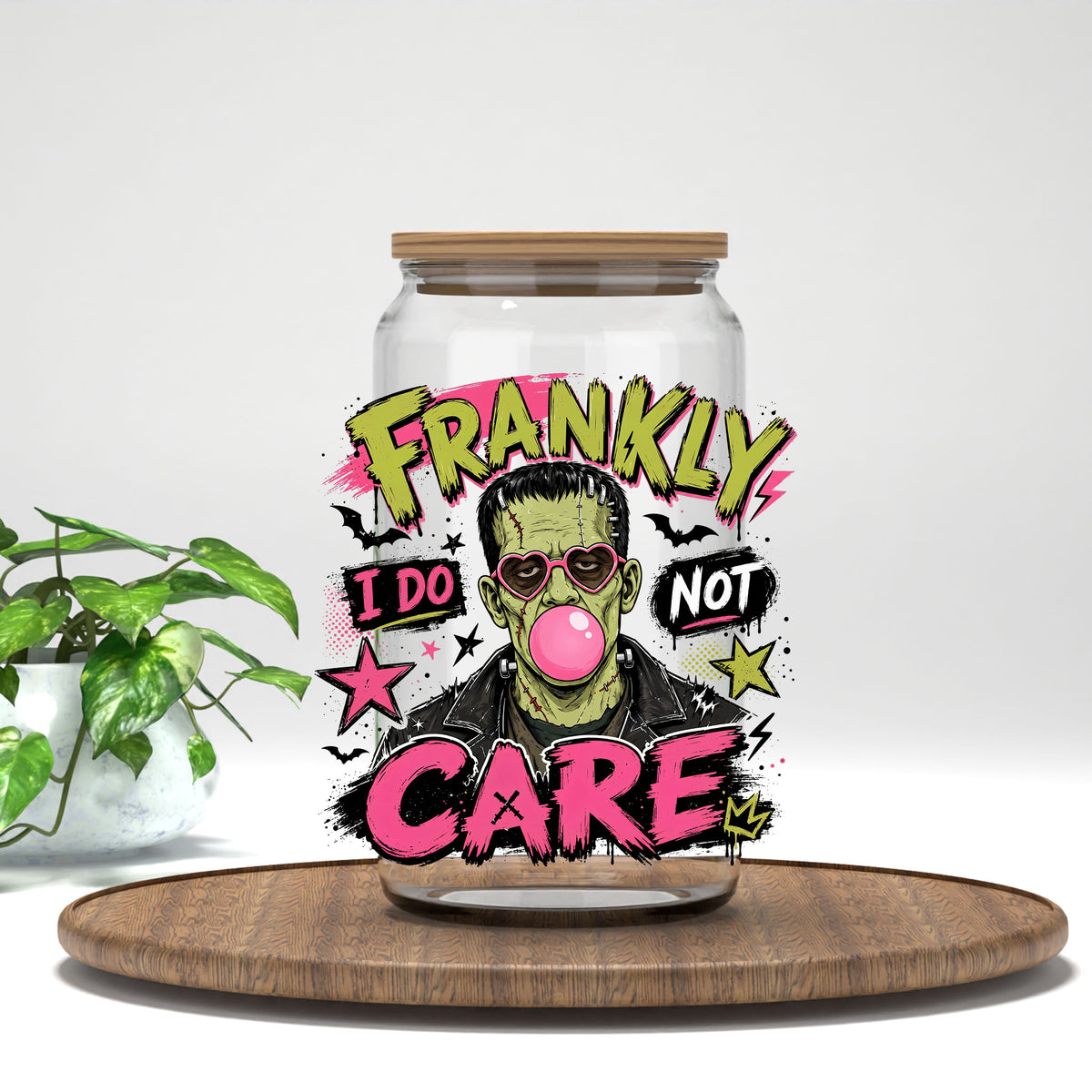 Frankly I Do Not Care monster UV DTF transfer on a clear glass can with a bamboo lid