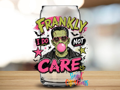 Close-up of the Frankly I Do Not Care monster UV DTF transfer on a clear glass can