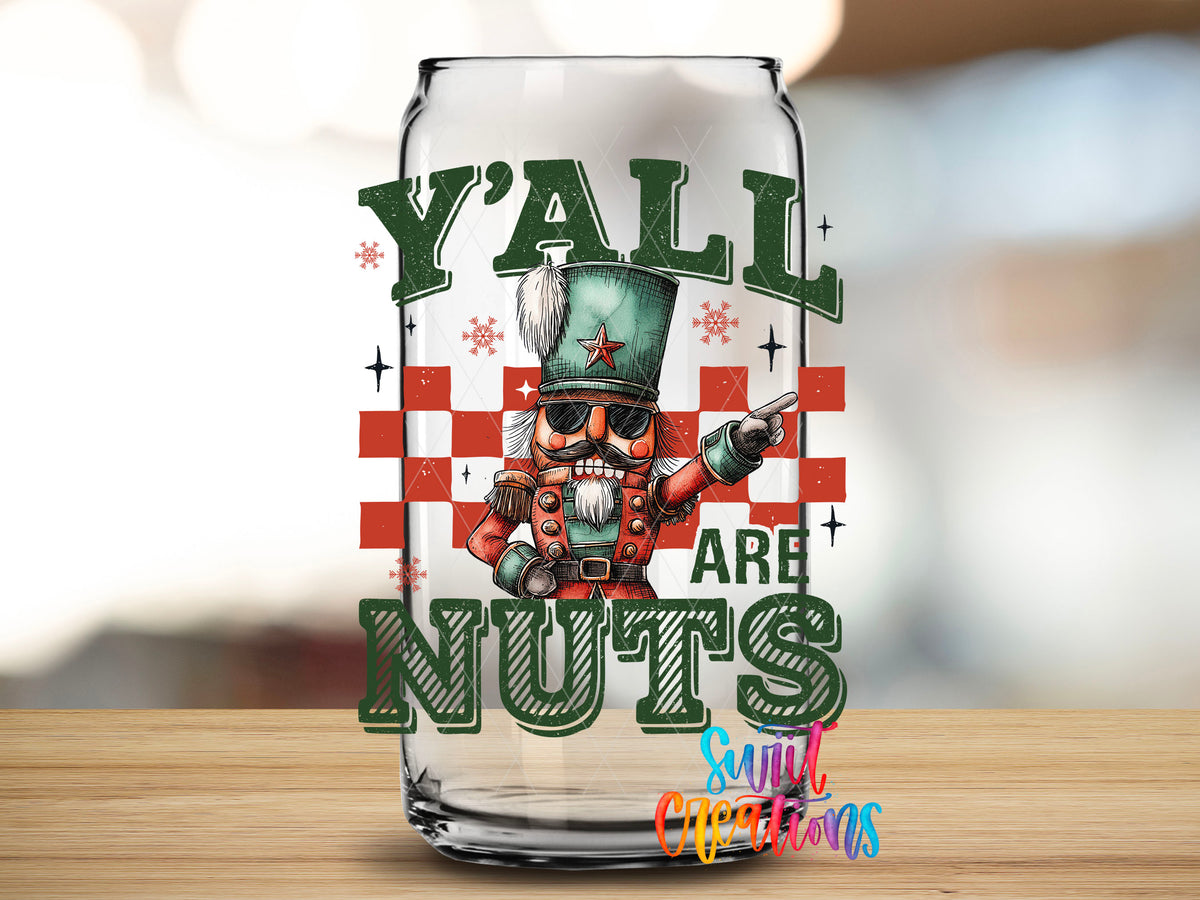 Close-up of the Y'all Are Nuts nutcracker UV DTF transfer on a clear glass can