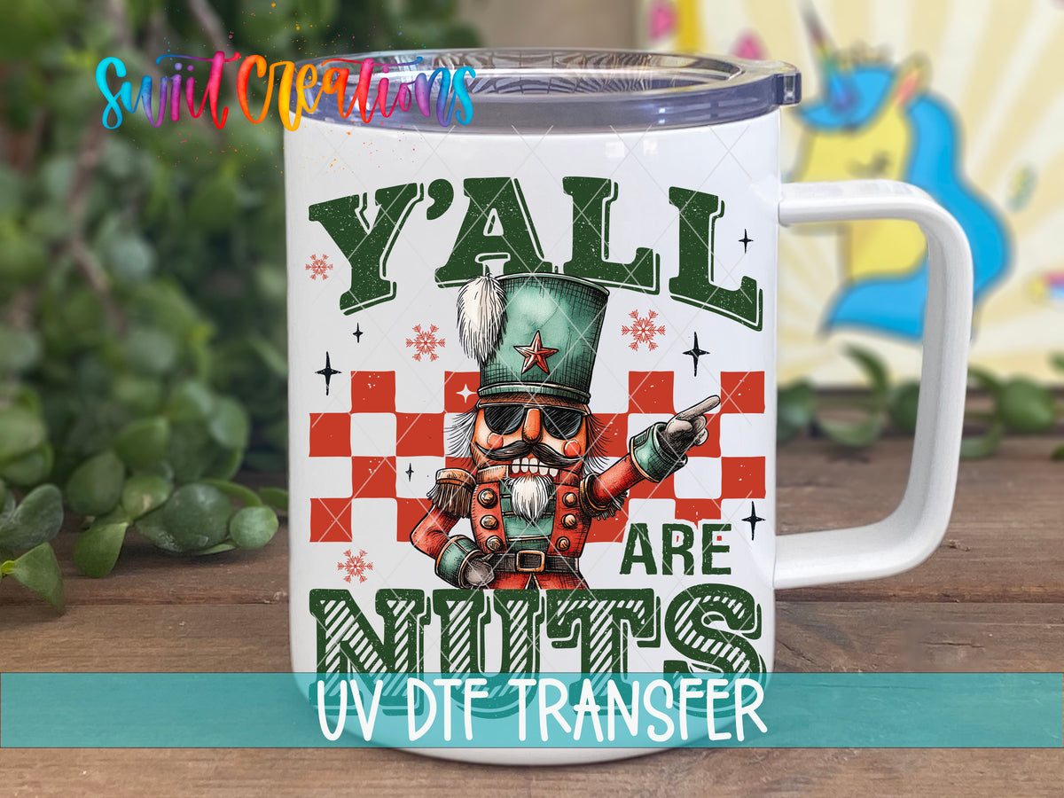 Y'all Are Nuts nutcracker UV DTF transfer on a white stainless steel mug with a lid