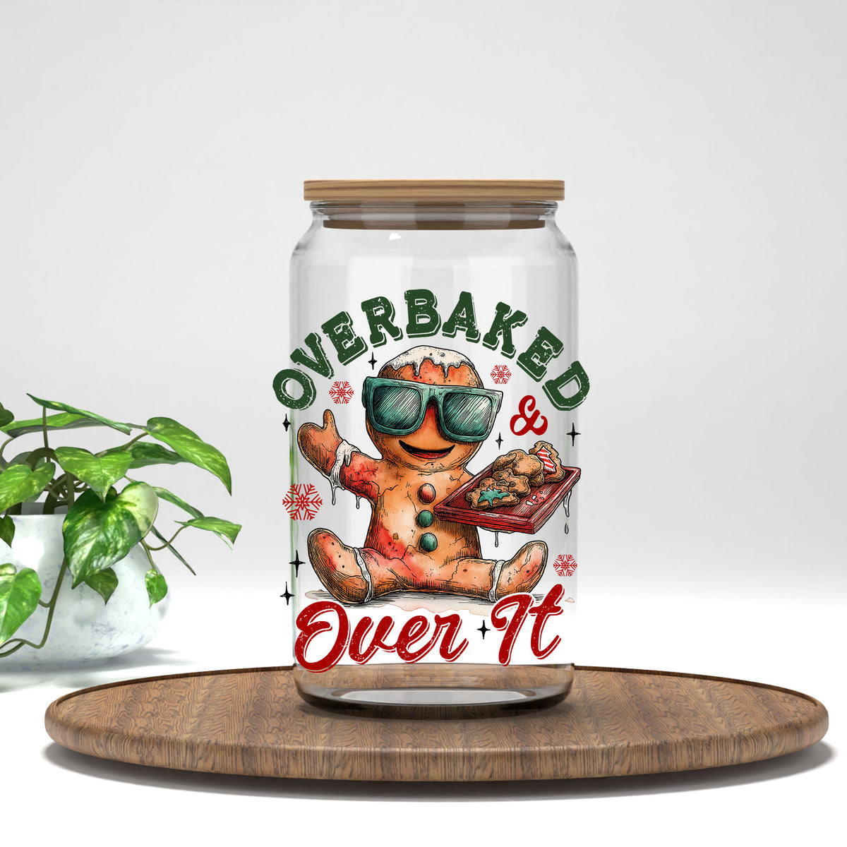 Overbaked And Over It gingerbread UV DTF transfer on a clear glass can with a bamboo lid