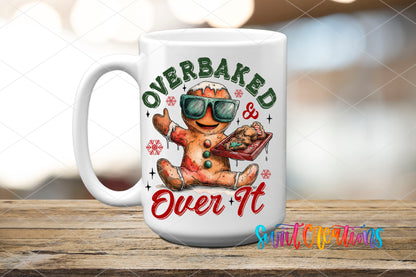 Overbaked And Over It gingerbread UV DTF transfer on a white ceramic coffee mug