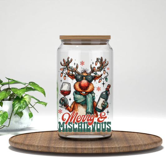 Merry and Mischievous reindeer UV DTF transfer on a clear glass can with a bamboo lid