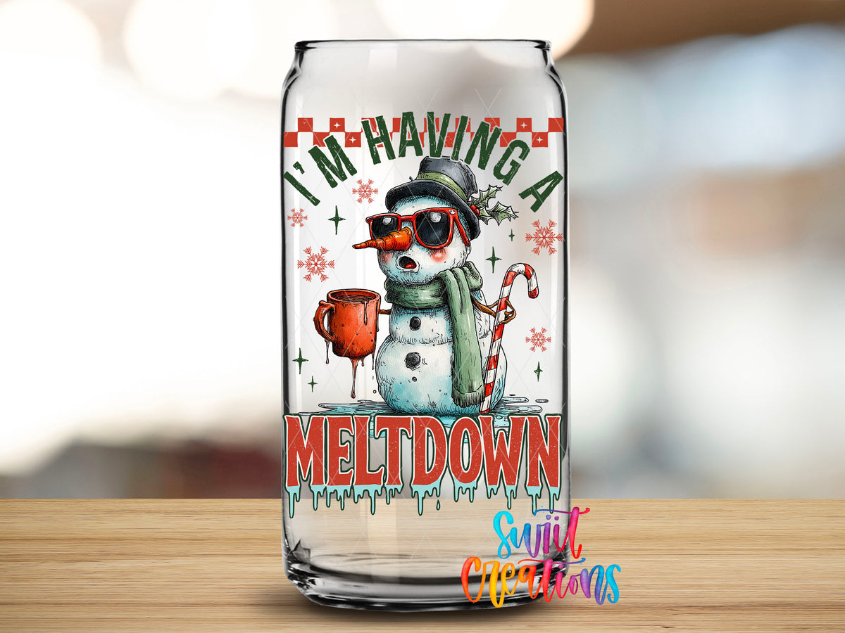 Close-up of the I'm Having A Meltdown snowman UV DTF transfer on a clear glass can