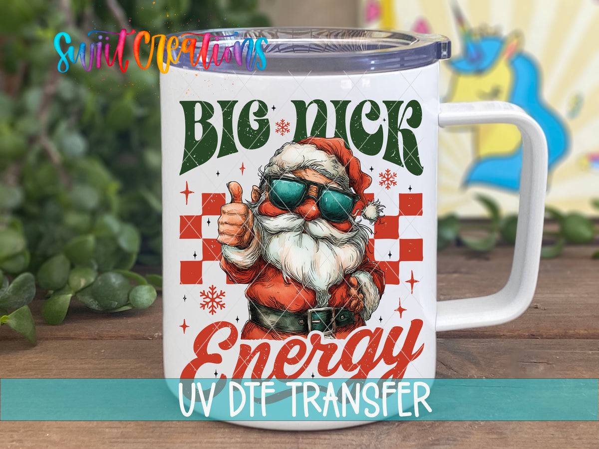 Big Nick Energy Santa UV DTF transfer on a white stainless steel mug with a lid