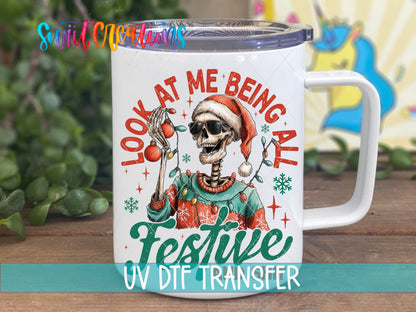 Look At Me Being All Festive And Sh*t skeleton UV DTF transfer on a white stainless steel mug with a lid