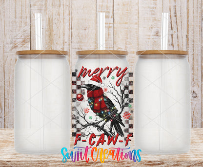 Merry F-CAW-F crow UV DTF transfer on three frosted glass cans on a wood background