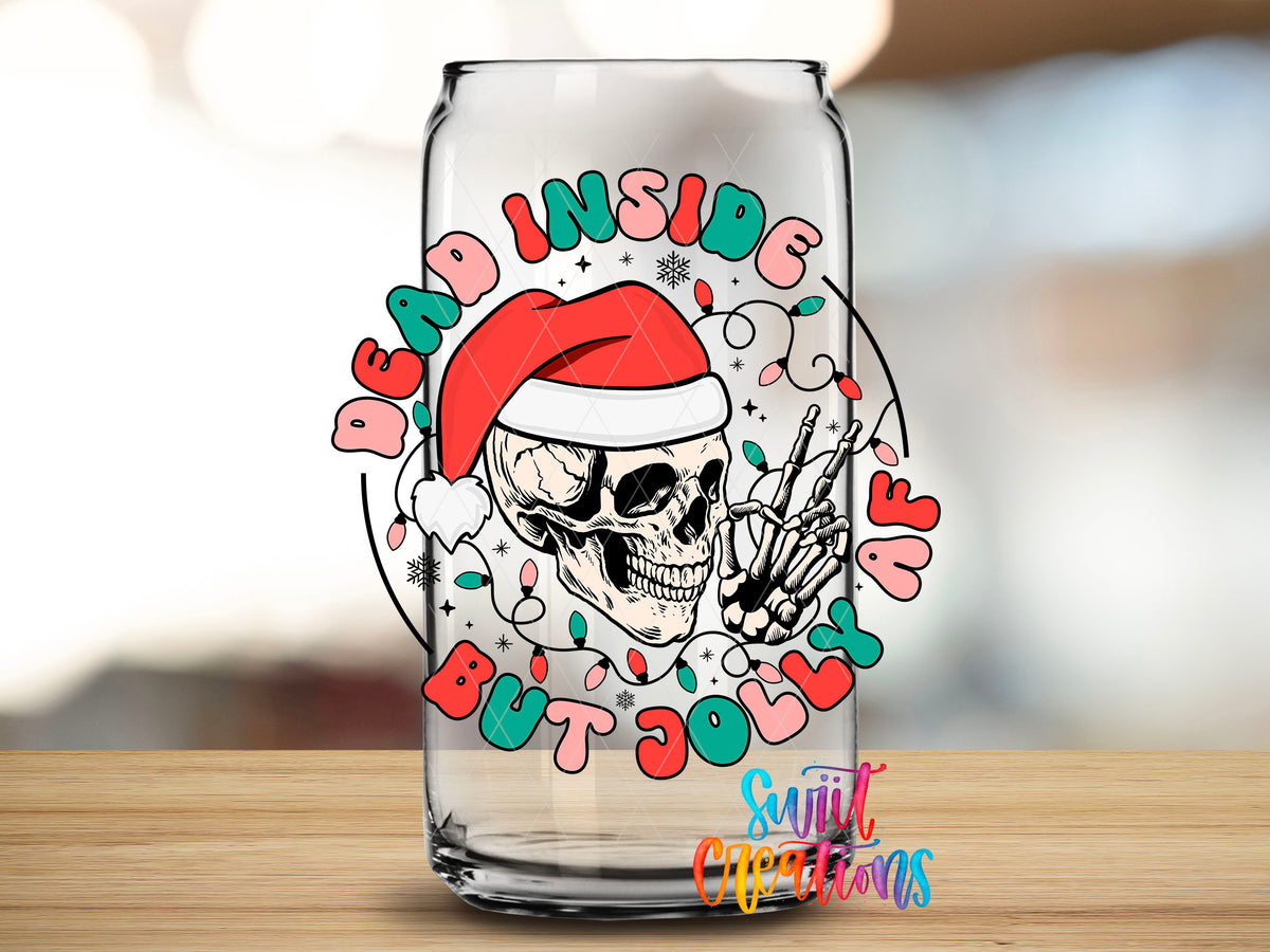 Close-up of the Dead Inside But Jolly AF skeleton UV DTF transfer on a clear glass can