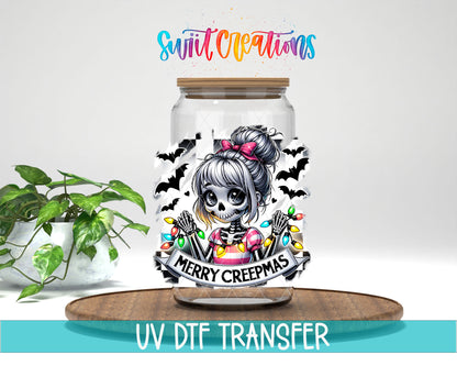 Merry Creepmas skeleton girl UV DTF transfer on a clear glass can with a teal UV DTF Transfer banner