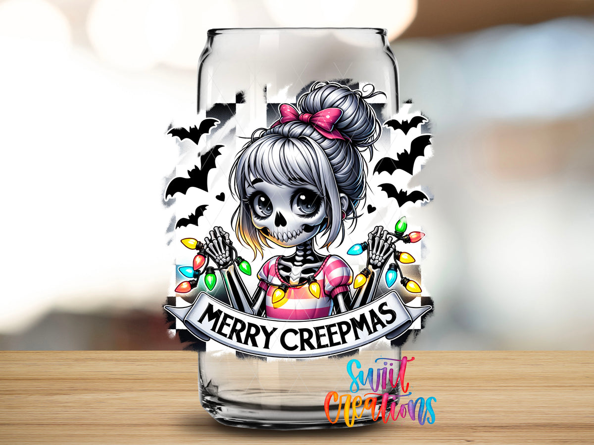 Close-up of the Merry Creepmas skeleton girl UV DTF transfer on a clear glass can