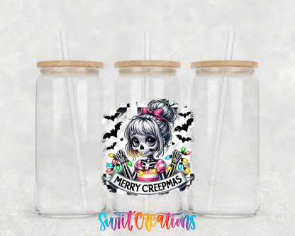 Merry Creepmas skeleton girl UV DTF transfer on three clear glass cans