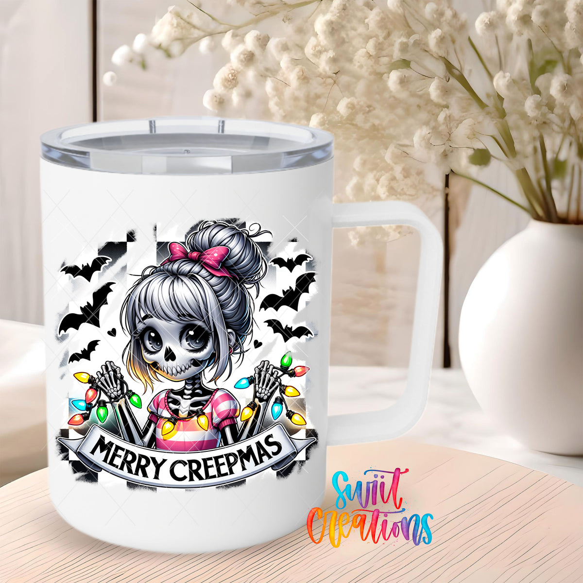 Merry Creepmas skeleton girl UV DTF transfer on a 12 oz white stainless steel mug