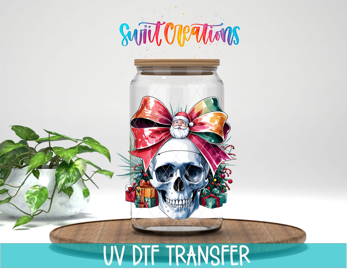 Christmas Croquette Skull UV DTF transfer on a clear glass can with a teal UV DTF Transfer banner