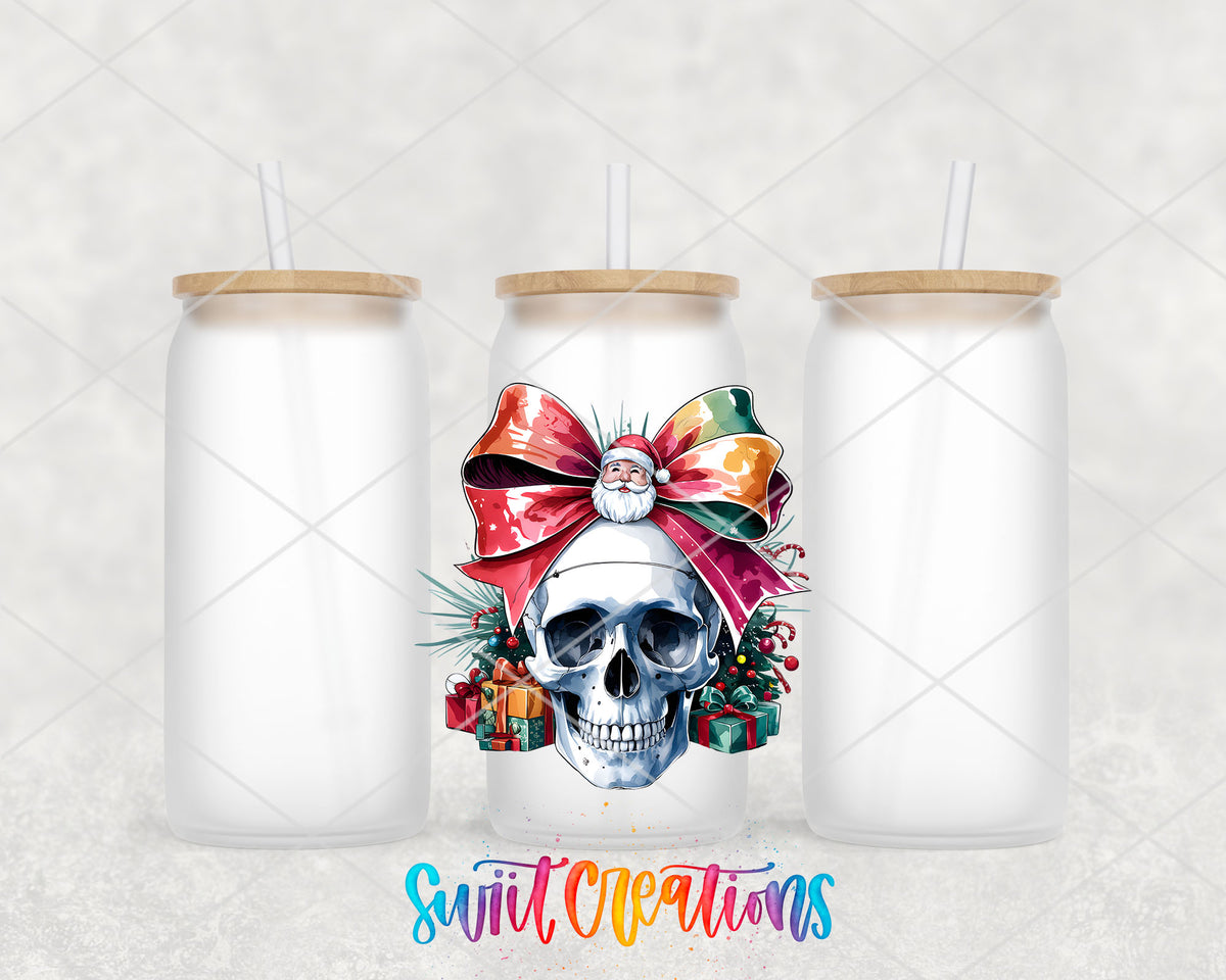 Christmas Croquette Skull UV DTF transfer on three frosted glass cans on a white background