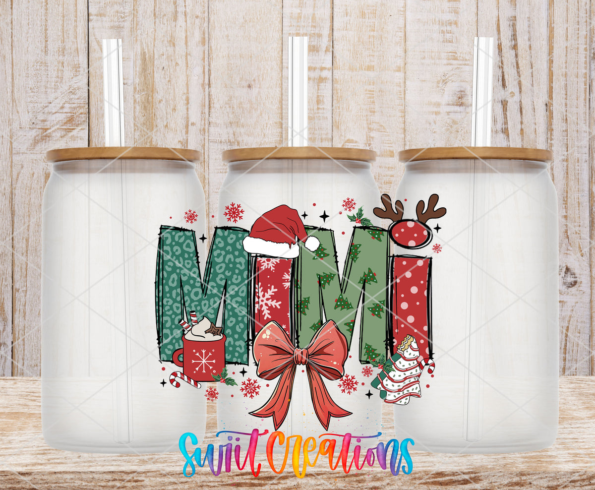 Mimi Christmas UV DTF transfer on three frosted glass cans on a wood background