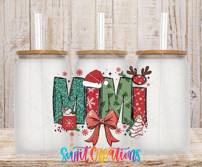 Mimi Christmas UV DTF transfer on three frosted glass cans on a wood background