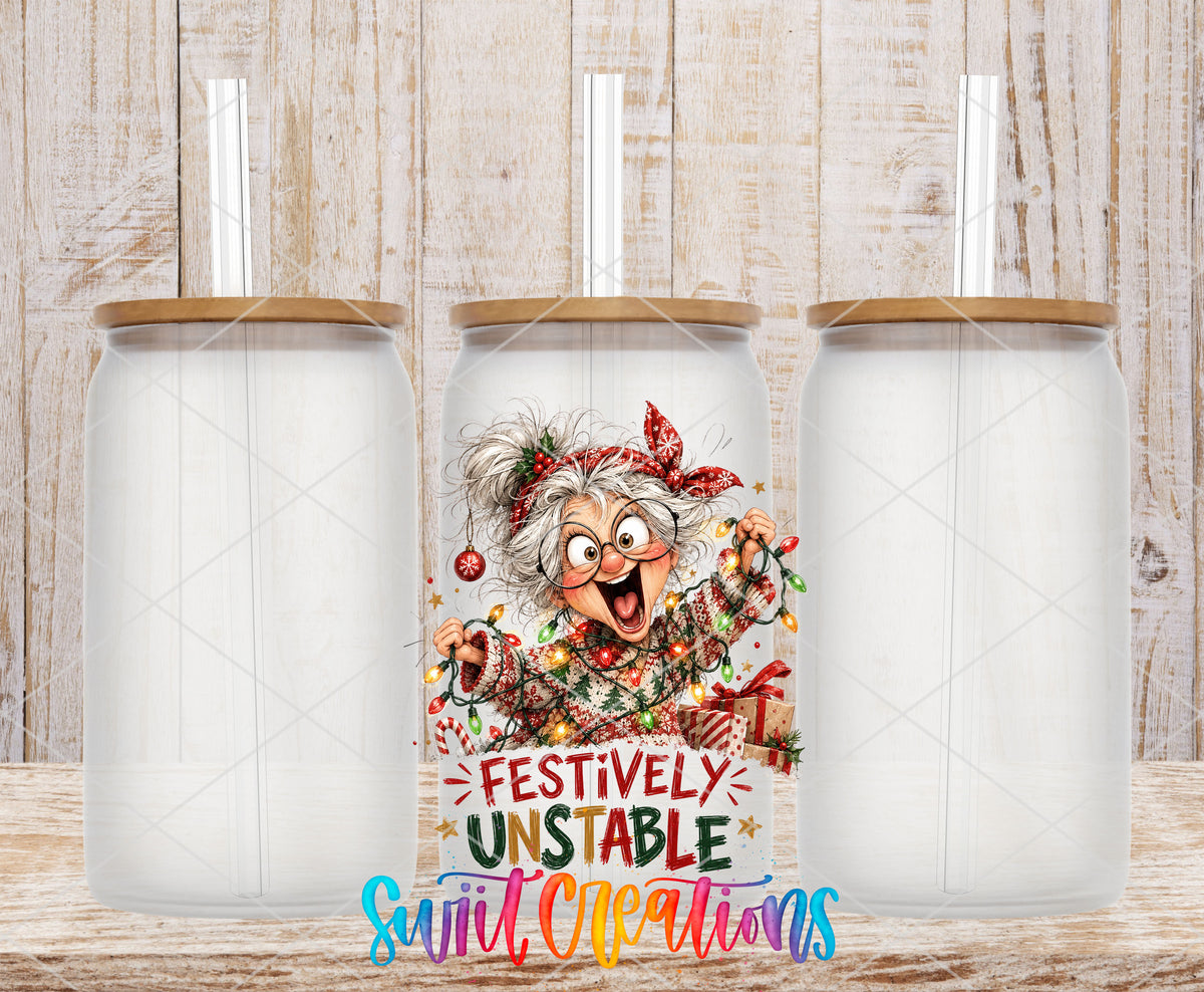 Festively Unstable grandma UV DTF transfer on three frosted glass cans on a wood background