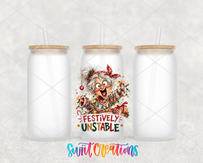 Festively Unstable grandma UV DTF transfer on three frosted glass cans on a white background