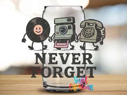 Close-up of the Never Forget UV DTF transfer on a clear glass can