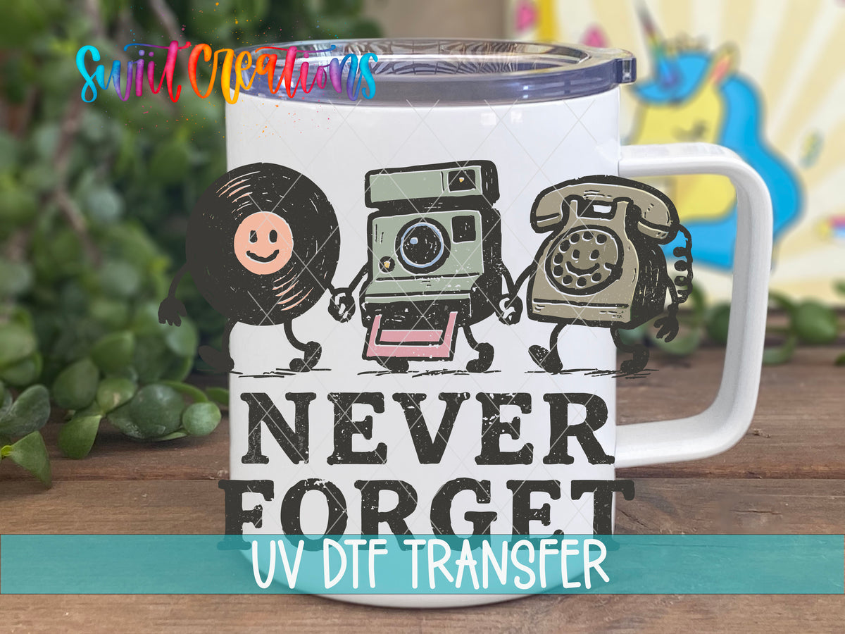 Never Forget UV DTF transfer on a white stainless steel mug with a lid