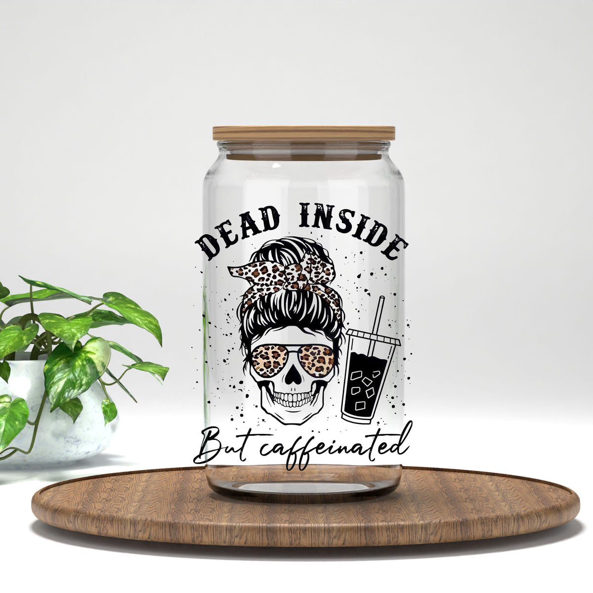 Dead Inside But Caffeinated messy bun skull with iced coffee UV DTF transfer on a clear glass can
