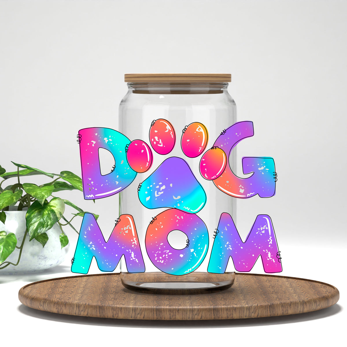 Dog Mom tie dye letters UV DTF transfer on a clear glass can