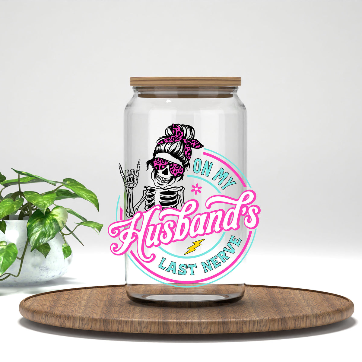 On My Husband's Last Nerve pink messy bun skeleton UV DTF transfer on a clear glass can