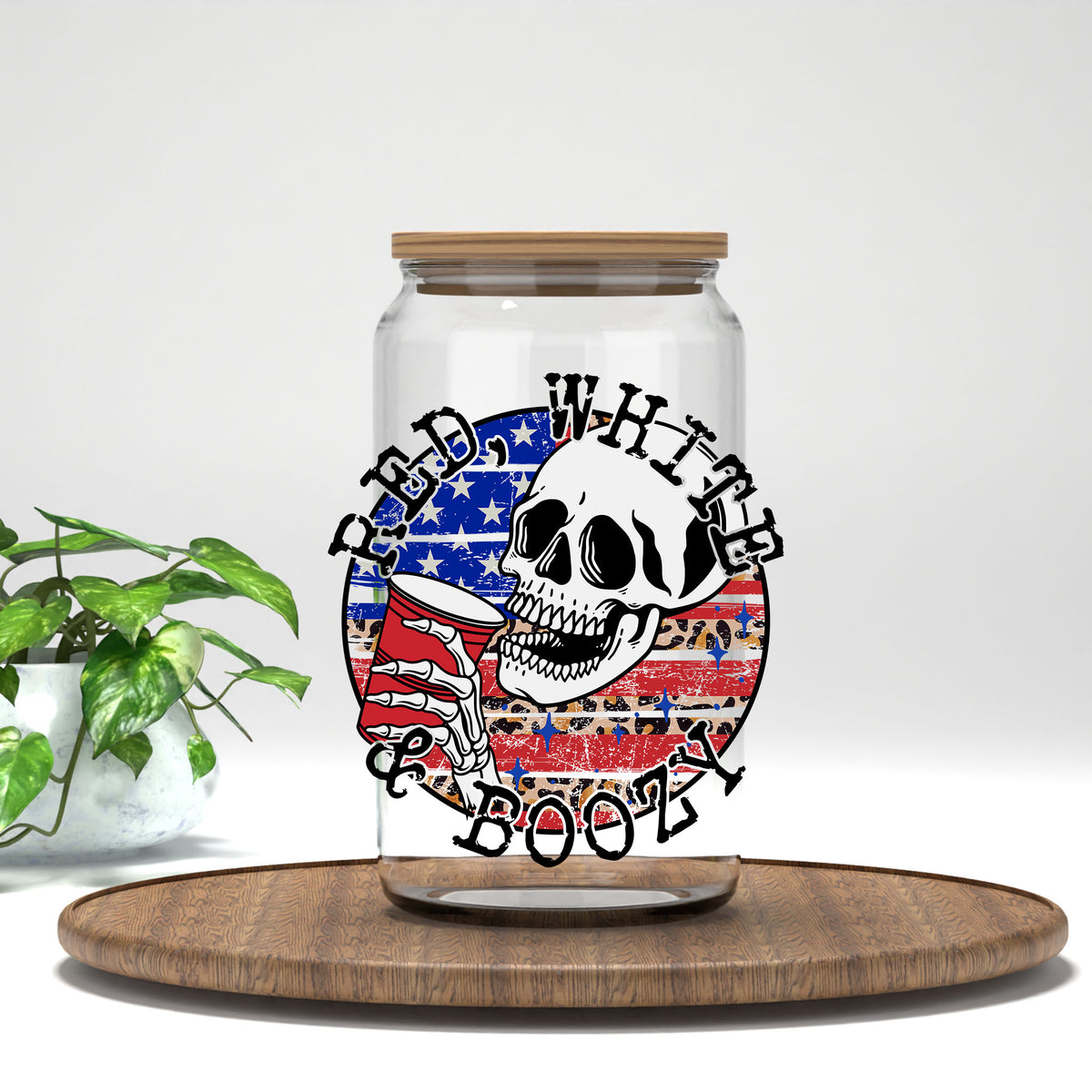 Red White and Boozy UV DTF transfer on a clear glass can