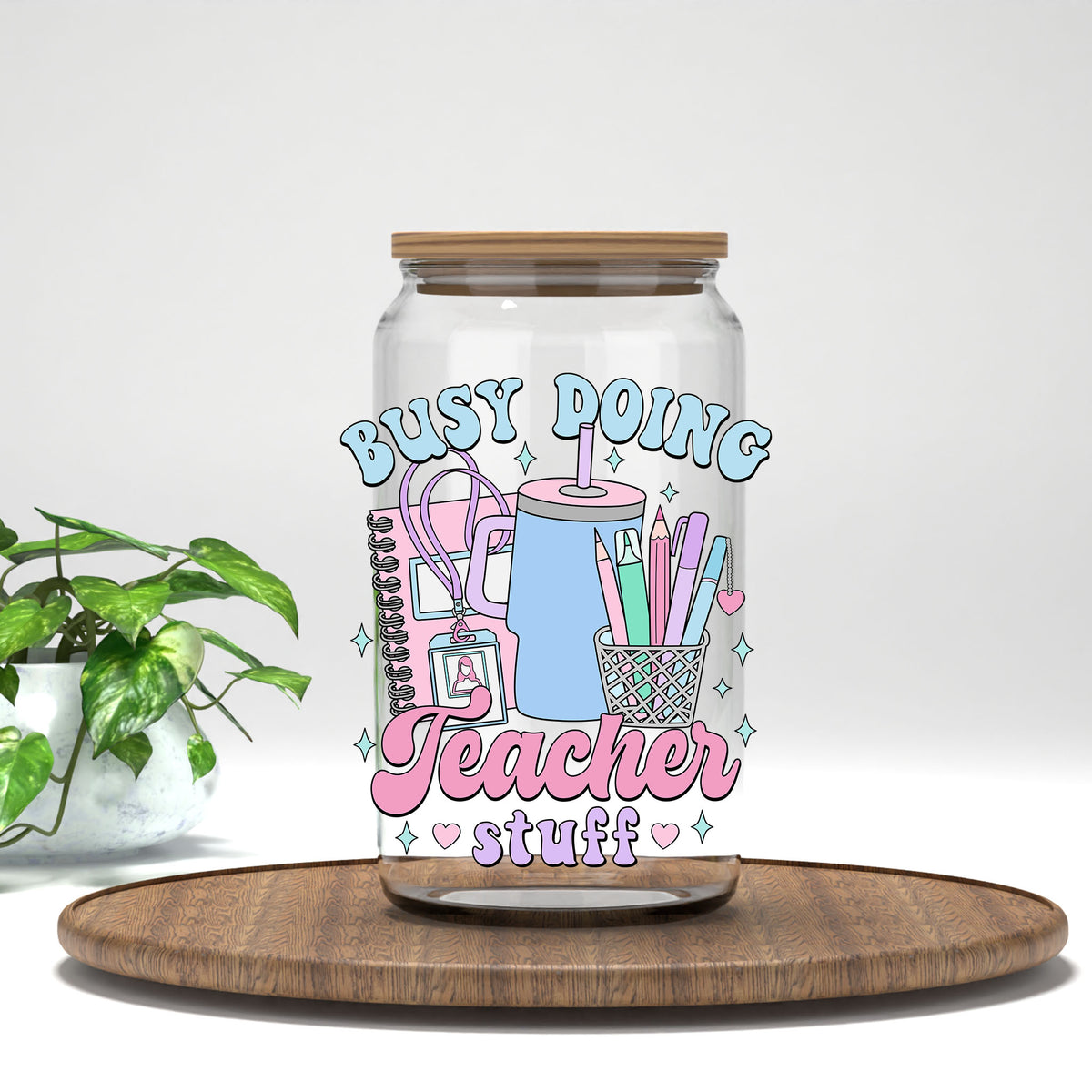 Busy Doing Teacher Stuff UV DTF transfer on a clear glass can