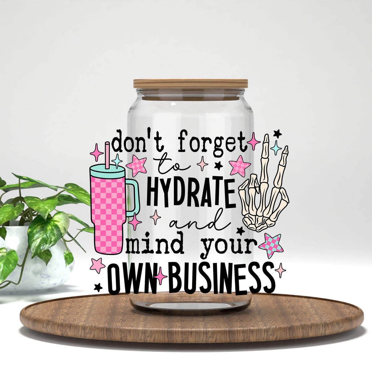 Hydrate and Mind Your Own Business UV DTF transfer on a clear glass can