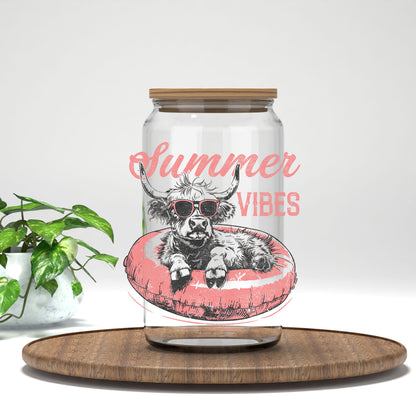 Summer Vibes highland cow on a pink float UV DTF transfer on a clear glass can
