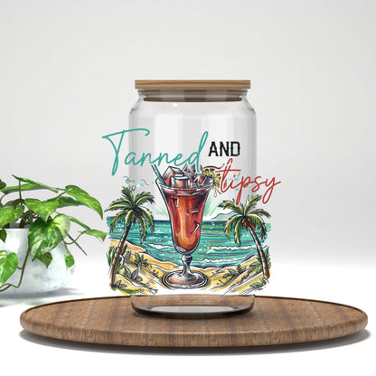 Tanned and Tipsy beach cocktail UV DTF transfer on a clear glass can
