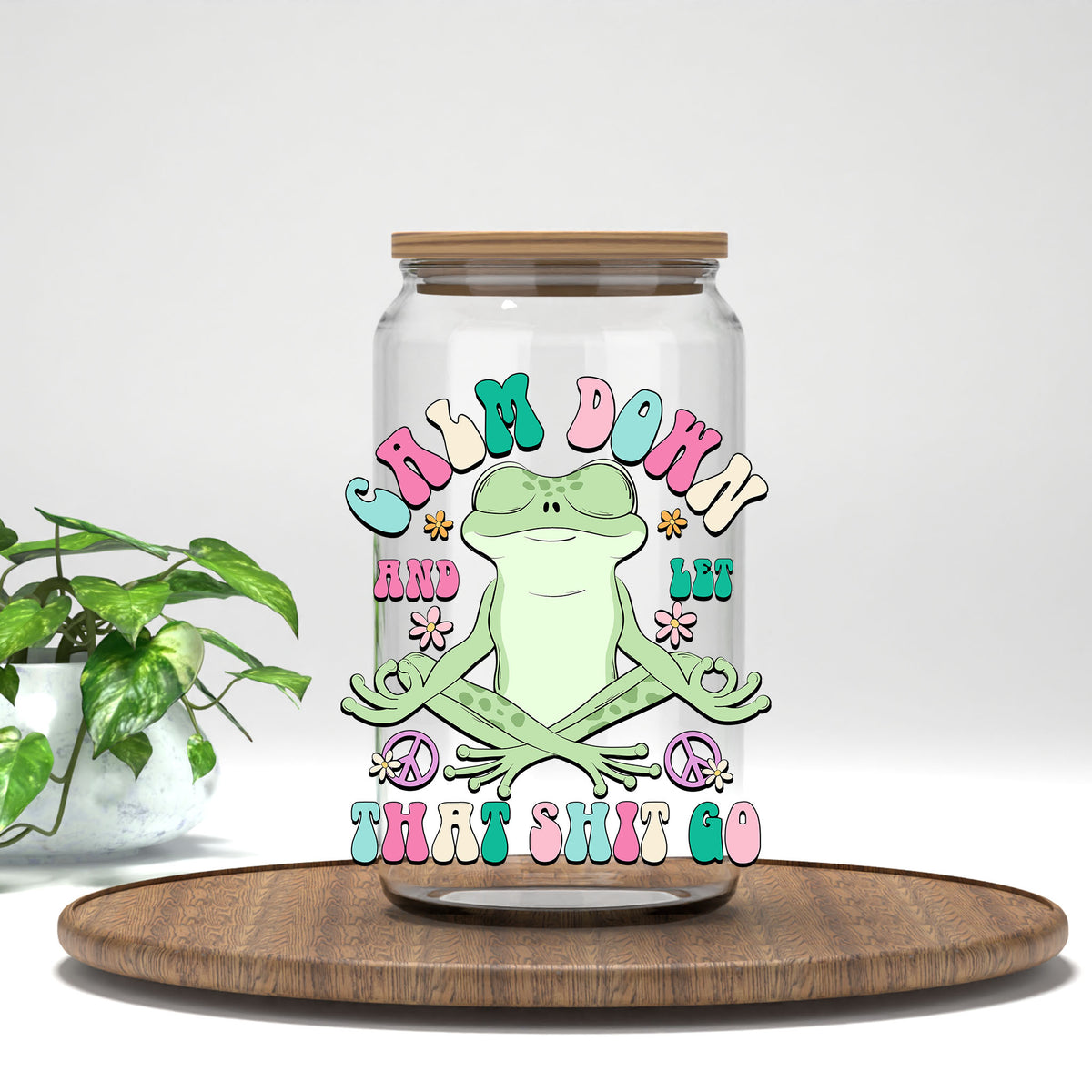 Calm Down and Let That Sh*t Go UV DTF transfer on a clear glass can